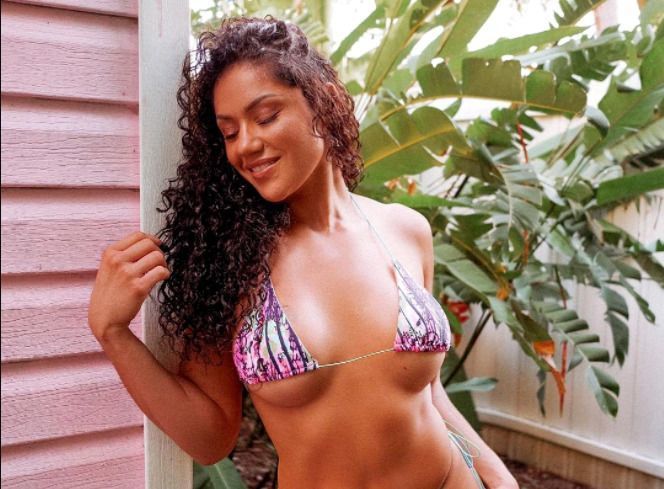 Former UFC fighter Gonzalez performs splits in a thong