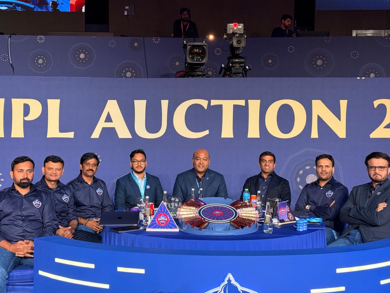 Delhi Capitals co.owners Kiran Kumar Grandhi and Parth Jindal along with the team management at the IPL auction: @Delhi Capitals Delhi Capitals co.owners Kiran Kumar Grandhi and Parth Jindal along with the team management at the IPL auction: @Delhi Capitals