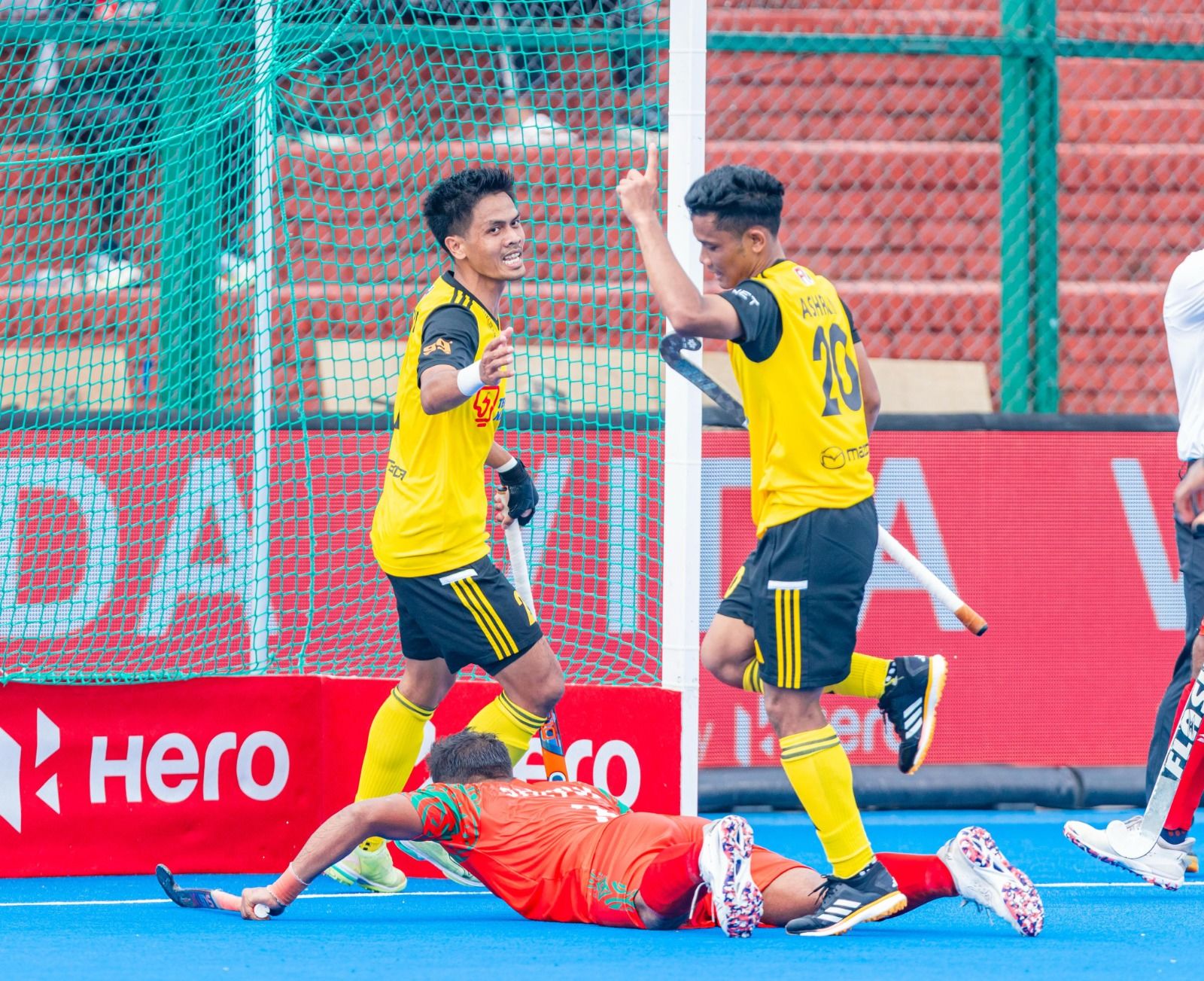 Malaysia players celebrate a goal. @Hockey India