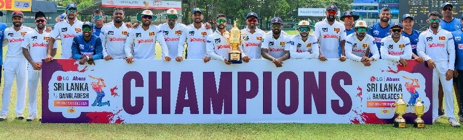 Sri Lankateam pose with the trophy after beating Banglaeh