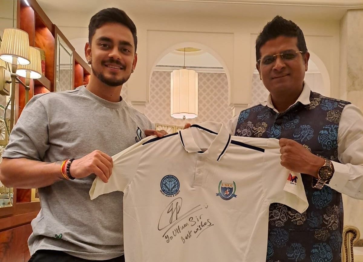 Ishan Kishan with coach Uttam Mazumdar.