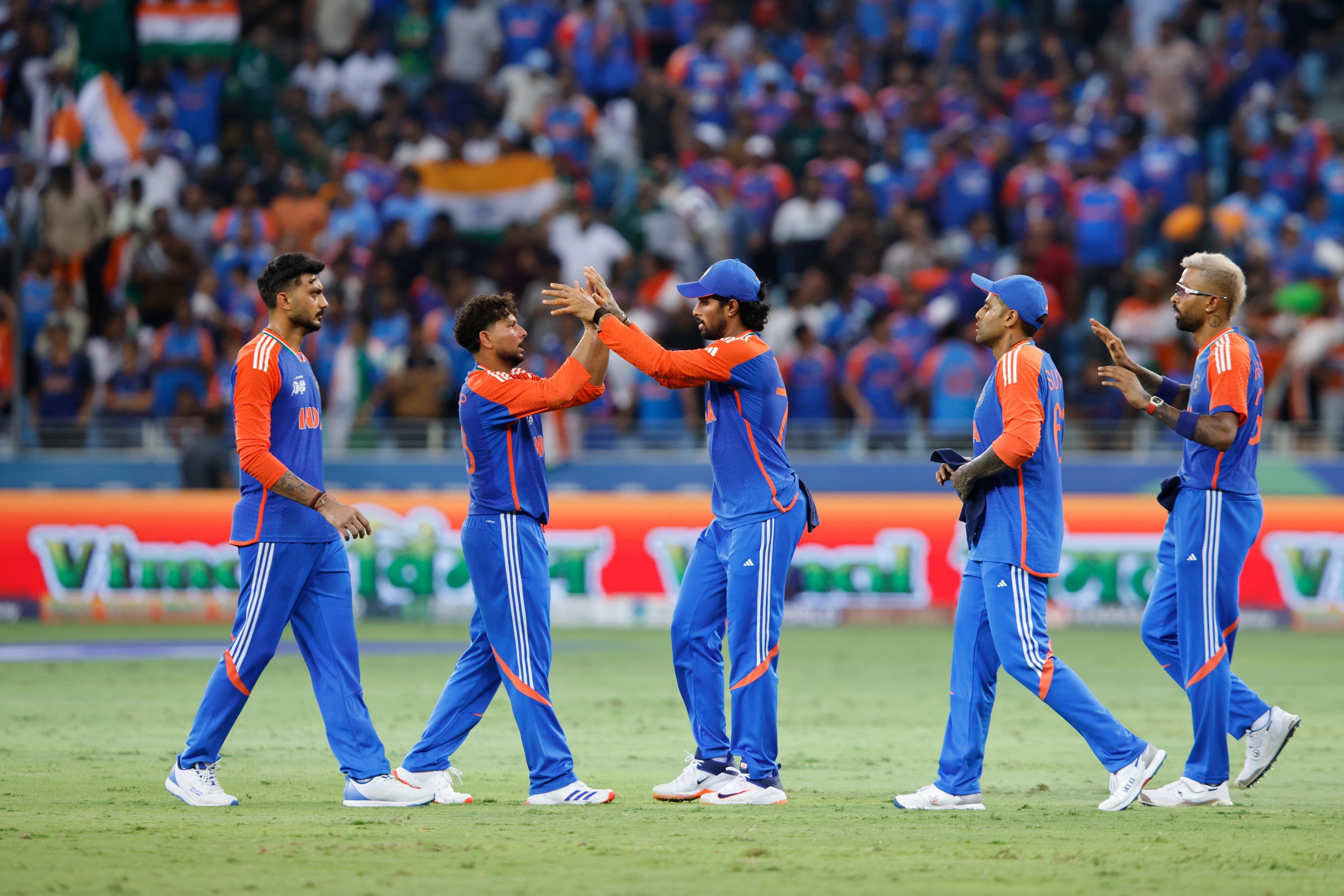 India players celebrate a wicket by Kuldeep Yadav. @BCCI