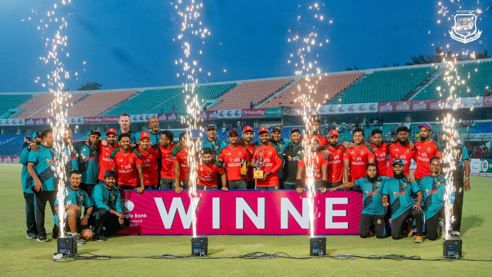 Bangladesh players celebrate with the trophy. @BangladeshCricket/X