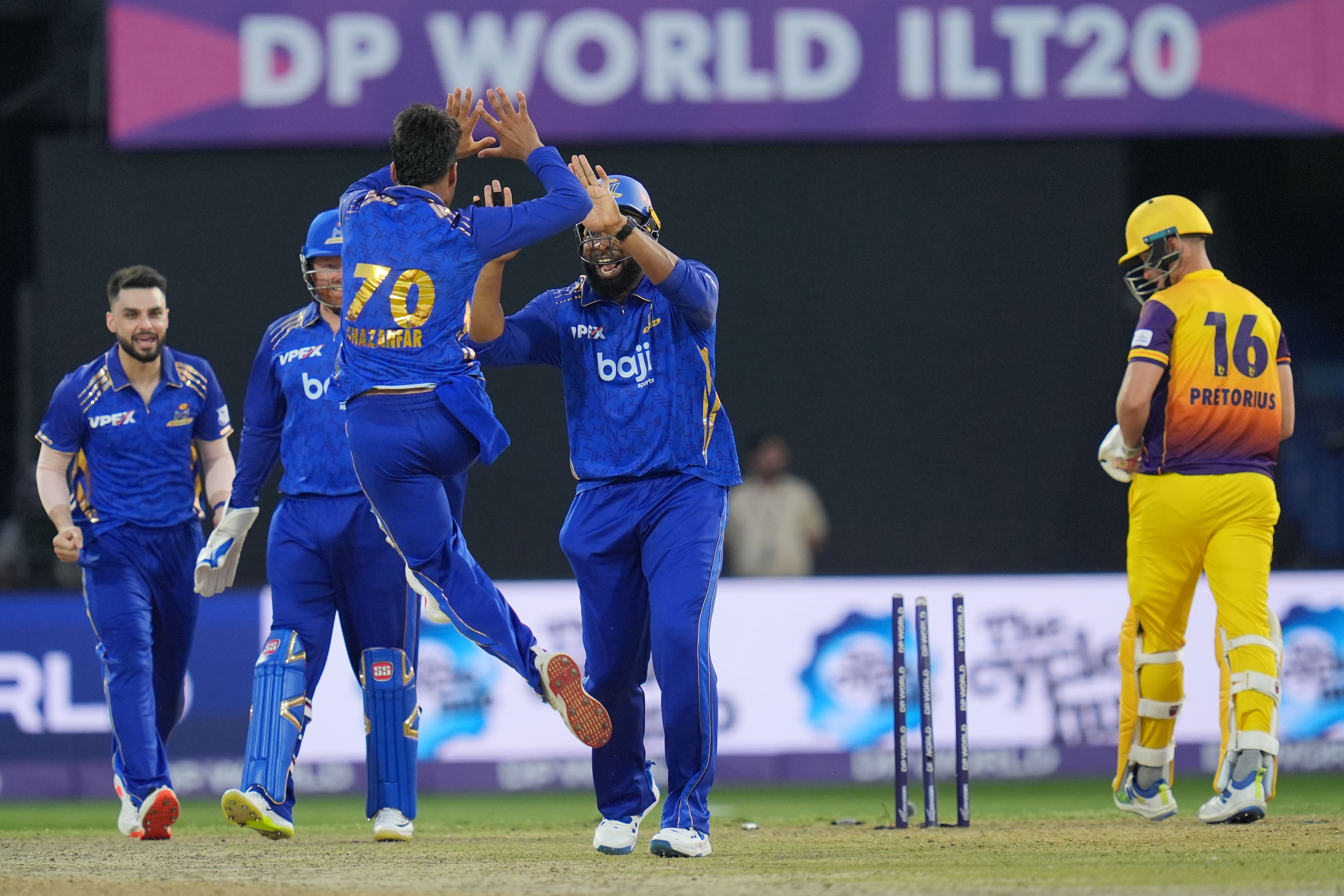 MI Emirates players celebrate a wicket against Sharjah Warriorz. @ILT20 MI Emirates players celebrate a wicket against Sharjah Warriorz. @ILT20