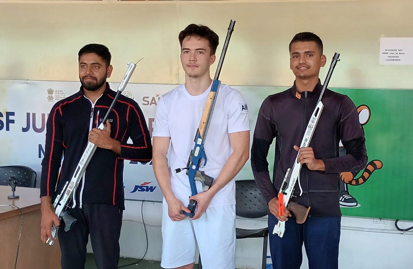 THE CHAMP: Russia's Kamil Nuriakhmetov, winner of the the men's 50 rifle prone event, is flanked by India's Deependra Shekawat Singh and Rohit Kanyan.