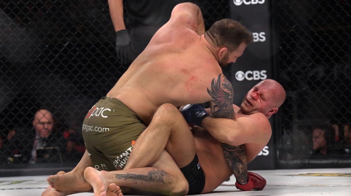 The Bloody elbow rests on Fedor's face