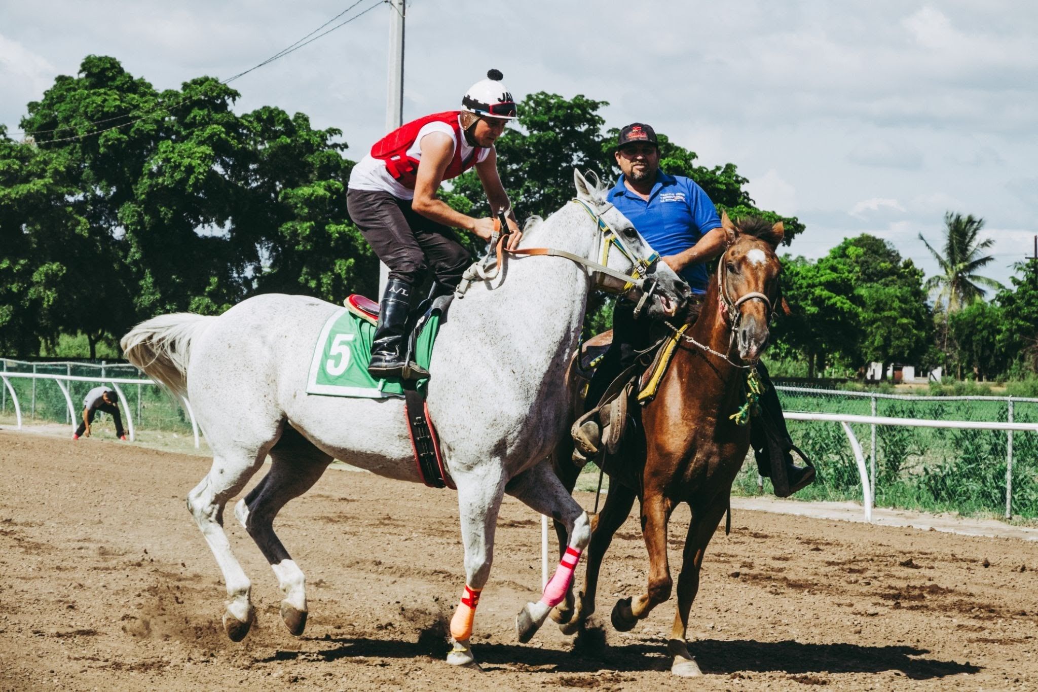 Image of trainer riding a horse