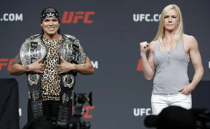 Holm (right) lost to Nunes via first-round TKO at UFC 239