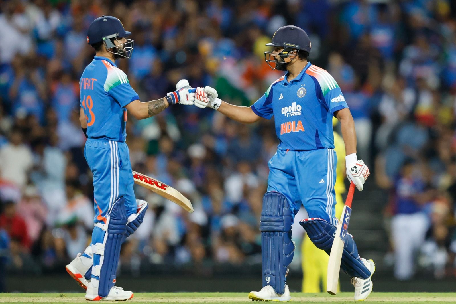 Rohit Sharma (121*) and Virat Kohli (74*) celebrate their  unbroken partnership after leading India to victory. @ICC/X