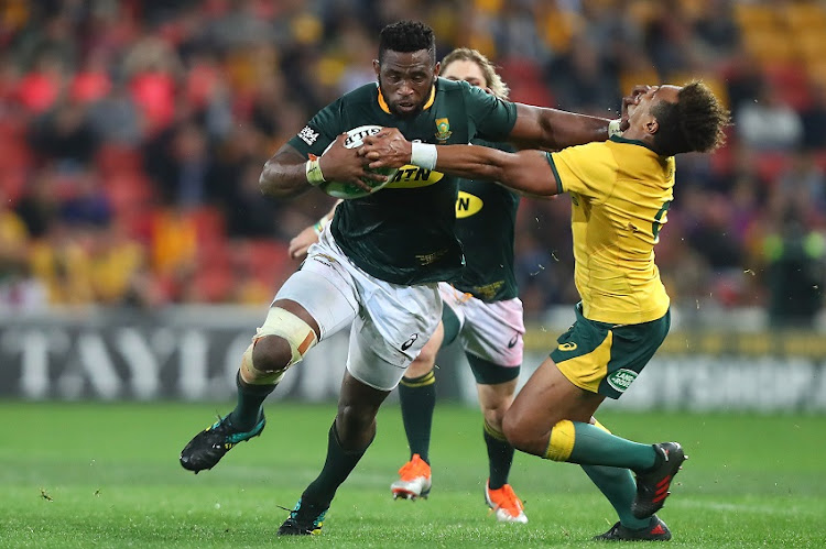 Springbok Siya Kolisi evades a tackle from Wallaby Will Genia during their Rugby Championship clash at Suncorp Stadium, Brisbane, on 8 September 2018. Springbok Siya Kolisi evades a tackle from Wallaby Will Genia during their Rugby Championship clash at Suncorp Stadium, Brisbane, on 8 September 2018.