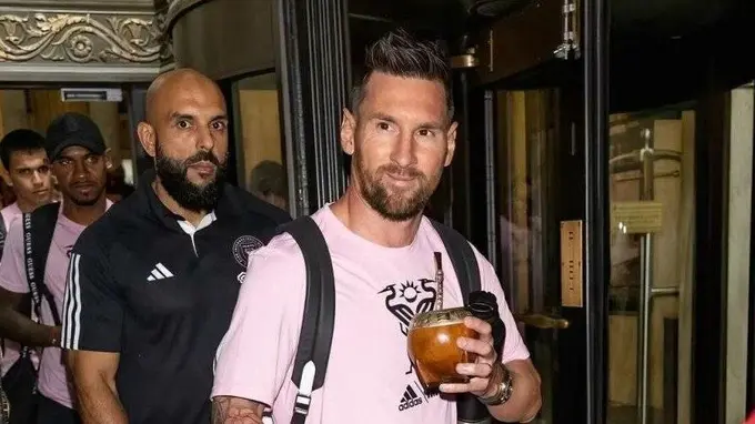 Lionel Messi with his bodyguard Yassine Cheuko behind him